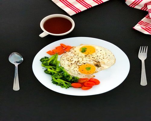 Balanced breakfast with eggs and tea